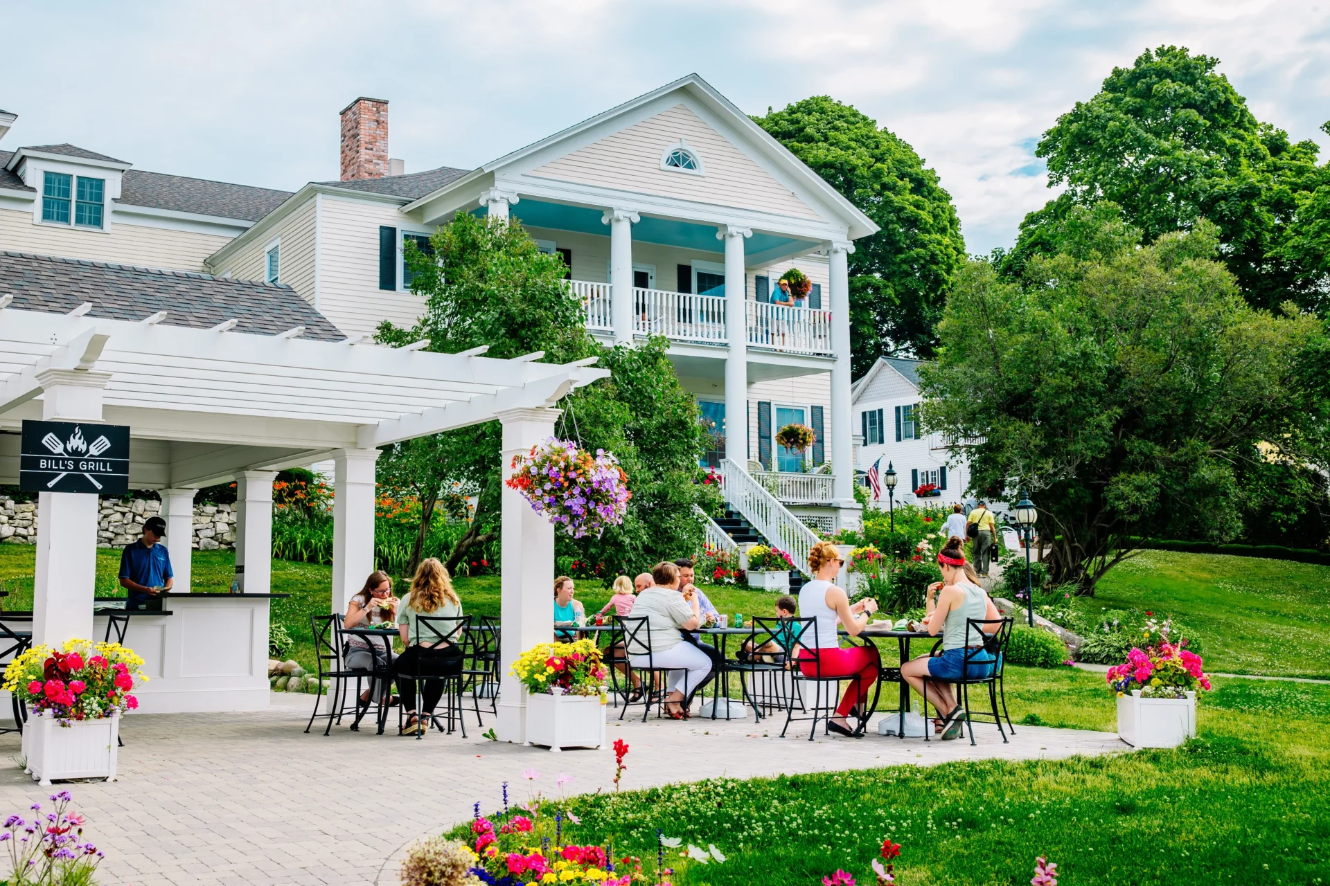 People eating breakfast outside on the porch of the Harborview Hotel.