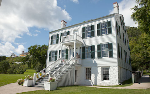 a white house with a staircase