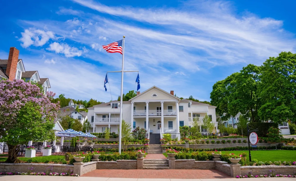 The front side of the Harborview Hotel showing the walking path and American flag.